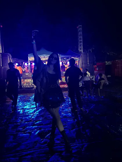A post-set moment of celebration at 'The Hundred Meet'. Even in the mud and aftermath of a huge outdoor party, the energy and good vibes remain.