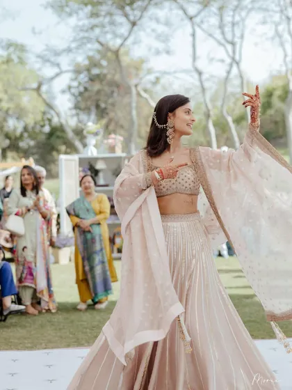 Another shot of the bride dancing, her joy evident. The simple hair and makeup allow for easy movement.