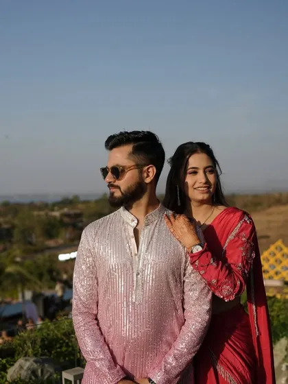 A stylish couple enjoying the view at their destination wedding. We help plan celebrations in locations that offer breathtaking backdrops.