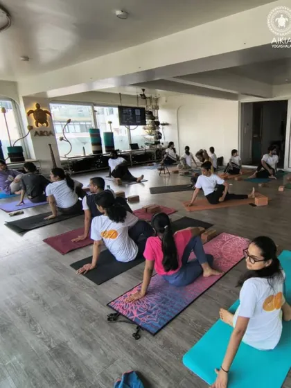 A new TTC batch begins their journey with intention and focus. The class atmosphere is one of serene dedication as they settle into their practice.