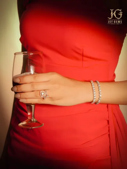 Red silk, golden light, and the undeniable allure of our diamond bracelets and ring.