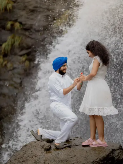 A surprise proposal during a pre-wedding shoot against the stunning backdrop of a waterfall. I help couples find unique locations to capture these once-in-a-lifetime moments, turning their love story into a visual adventure.