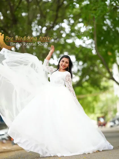 A happy, twirling shot in the white ball gown, perfect for capturing a carefree moment.