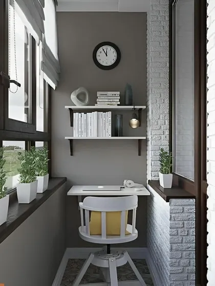 A serene workspace with a mix of textures. The design combines a simple white desk and shelves with a grey accent wall and exposed white brick, creating a calm and contemporary feel.