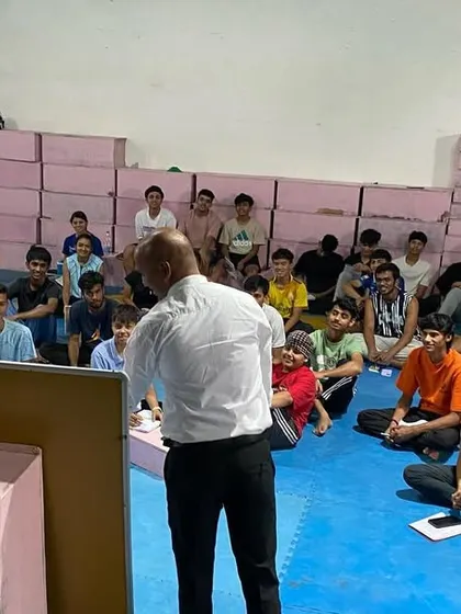 A student asks a question during the rules and nutrition workshop. We foster an environment where curiosity is encouraged and every athlete feels comfortable seeking knowledge.