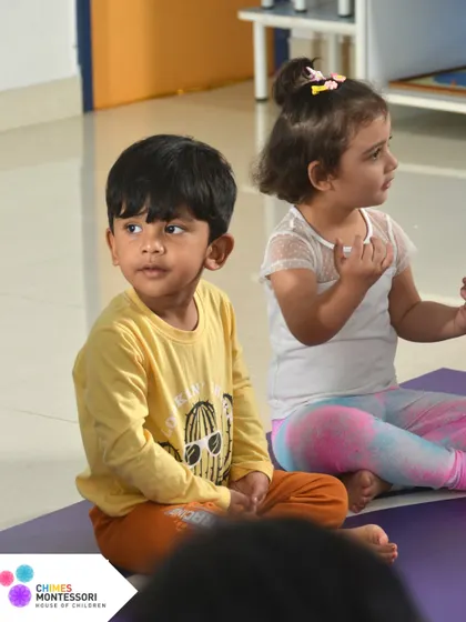 Children sit attentively during a group lesson, their absorbent minds ready to soak in new knowledge and stories.