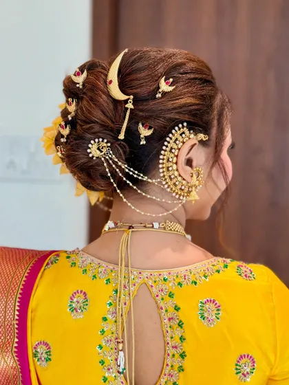 A close-up of the intricate accessories on a traditional Khopa, showing how each piece is carefully placed to create a stunning final look.
