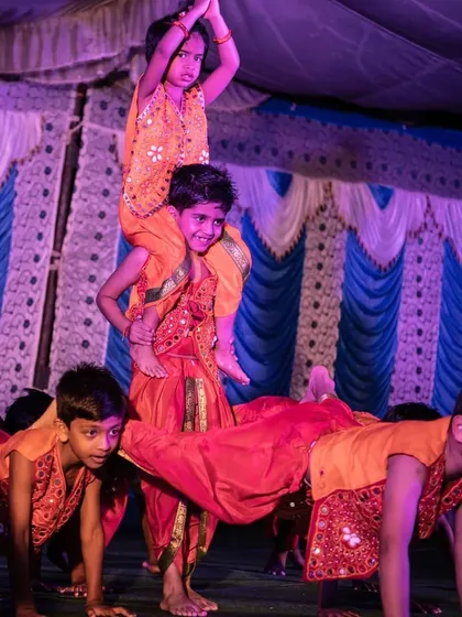 Look at the focus and teamwork from my amazing kids during their Ganesh Chaturthi performance. I choreograph routines that are not only fun but also include impressive moves like this human pyramid, helping them shine on stage.