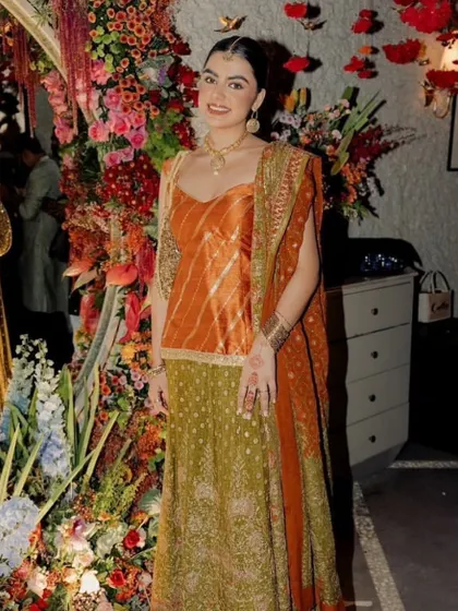 A full-length shot of Aaliyah Kashyap's Mehendi look. The traditional outfit is paired with clean, elegant makeup for a timeless and sophisticated style.