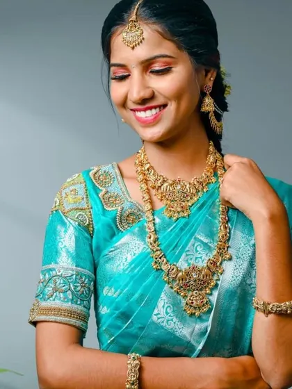 A happy bride-to-be trying on one of our traditional rental sets. The antique finish gives a rich, authentic look.