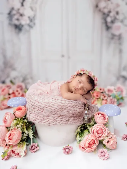 Another angle of the floral garden setup, this time against a clean white background, which makes the pink colors pop.