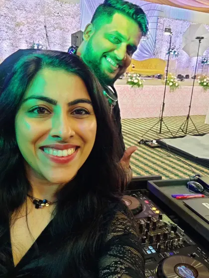 A behind-the-console selfie with the DJ. Teamwork makes the dream work, and our synergy ensures a seamless audio-visual experience for your wedding celebration.