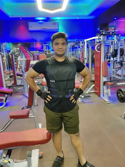 Dr. Kapil's current condition, standing strong and confident in the gym.