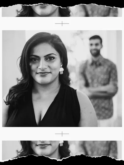 A powerful black and white portrait with the woman in sharp focus and her partner softly in the background. This composition tells a story of confidence and connection.