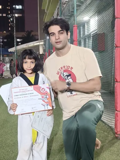 This young girl earned her yellow belt at the grading exam. Her focus and determination are impressive.