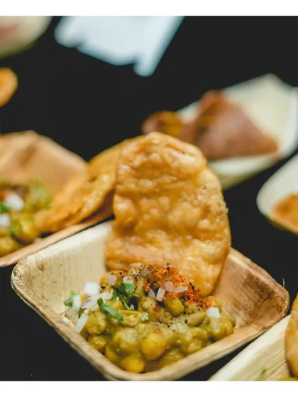 A close-up of our single-serving chaat, presented in an eco-friendly leaf bowl, combining traditional flavours with contemporary, sustainable presentation.