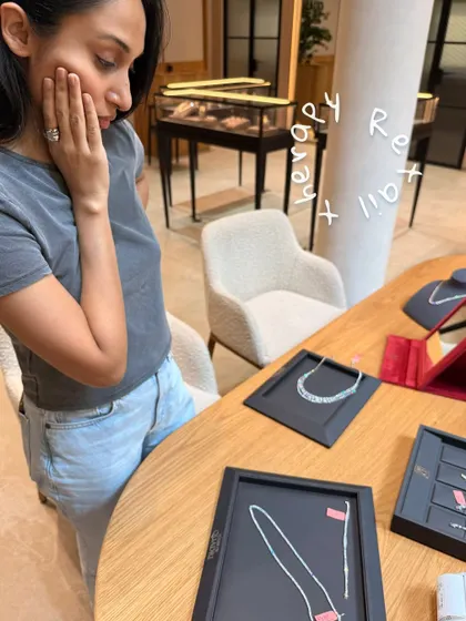 A glimpse into a client's retail therapy session. Helping her choose the perfect diamond jewelry is all part of the personal styling experience, ensuring every detail of the look is perfect.