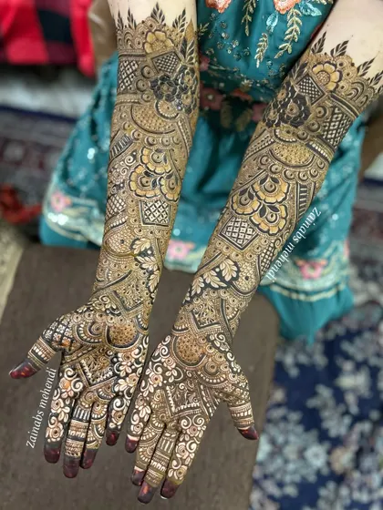 A complete bridal look showcasing how the designs on both hands are coordinated yet unique. I focus on creating a balanced and symmetrical look that is perfect for wedding photography.