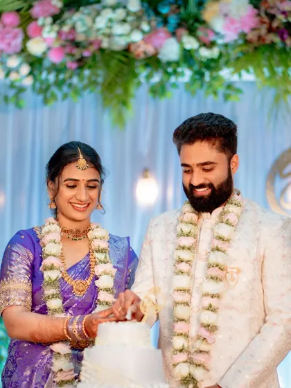 A beautiful moment from a traditional engagement in Sringeri. We document the rituals, like the cake cutting, while ensuring the couple's happiness remains the central focus of the photograph.
