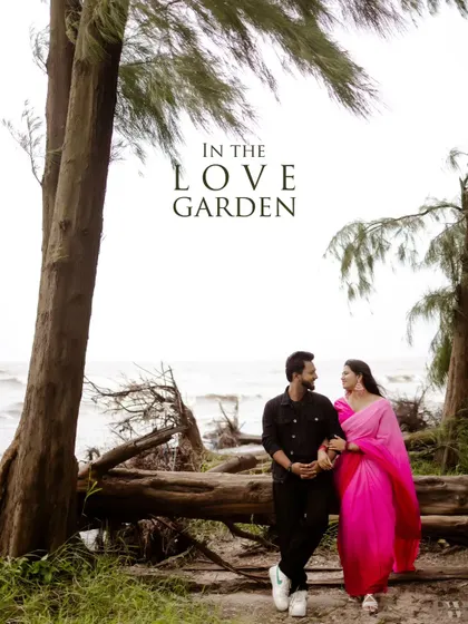 "In the Love Garden." This shot frames the couple against the sea, using the trees as a natural archway. It’s a perfect example of how I use the landscape to create a beautiful composition.