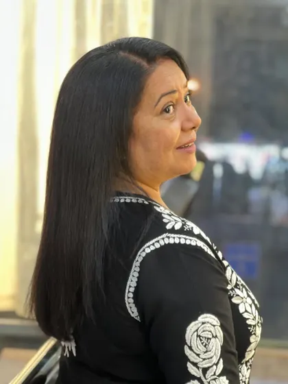 The beautiful result of Neelu Vaghela's hair revival. Her hair looks healthy, shiny, and perfectly styled.