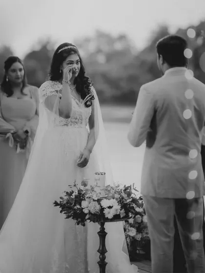 A lakeside vow ceremony is incredibly romantic. Sudhira and Prajwal exchange their promises against the serene water, with minimalistic floral decor enhancing the natural beauty of the location.
