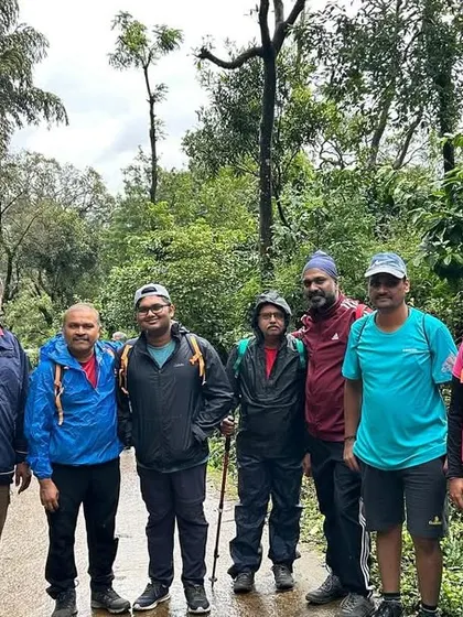 A group photo from a corporate trek. These adventures are a great way for teams to bond and build camaraderie outside the office.