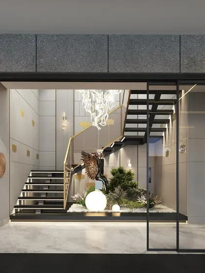 A modern staircase design featuring concrete panels with brass inlays. This combination of industrial chic and luxurious warmth creates a visually striking and one-of-a-kind look.
