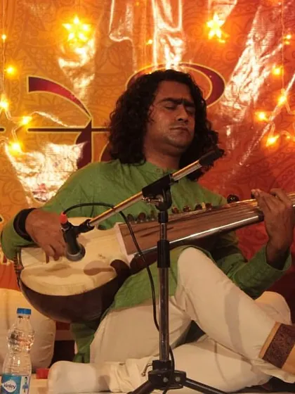Sh. Arnab Bhattacharya lost in the melody of his Sarod, a moment that captures the essence of music as a form of meditation.
