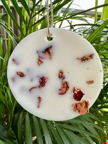 My rose-scented wax tablet, embedded with real rose petals. You can hang this in your wardrobe or place it in a drawer to keep your linens smelling divine.