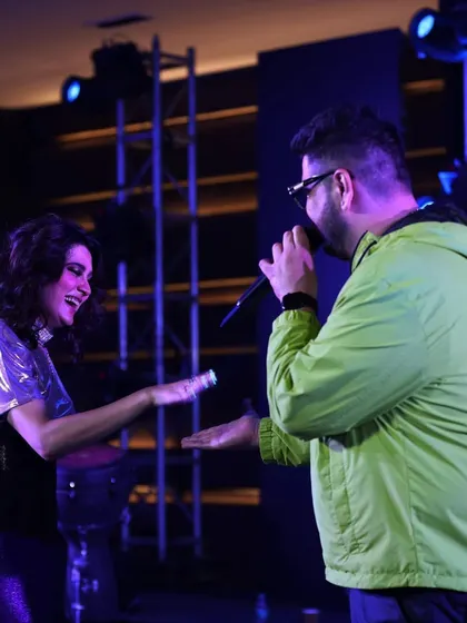 Artists Aastha Gill and DJ Sue performing on stage at the Round Table India event. Our stage and lighting design provided a dynamic and professional backdrop for the evening's entertainment.