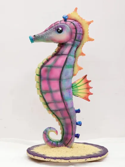 Another angle of the vibrant seahorse cake, highlighting the delicate fins and curved tail. This project is a fantastic introduction to the world of sculpted cakes.