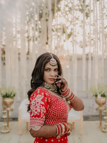 A powerful and confident pose. The makeup highlights her strong features while maintaining a soft and glamorous feel, perfect for a modern bride.