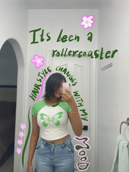 My hairstyle changes with my mood. A mirror selfie with doodles that reflect a green, butterfly theme.
