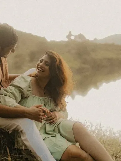 A peaceful and romantic portrait by the water. The soft light and natural surroundings create a perfect setting for capturing quiet, intimate moments.