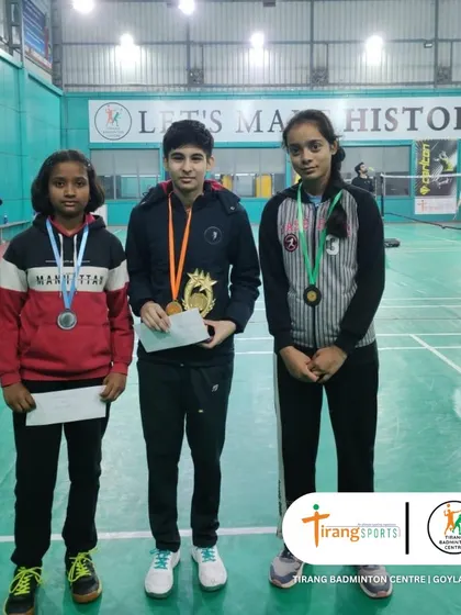 The top three finishers in a girls' category at the Shuttle Shufflers tournament. Their skill and sportsmanship were commendable throughout the event.