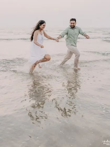 Pure, unscripted joy as a couple runs through the waves at a Nashik beach. We love capturing these carefree moments where you can forget the camera and just enjoy being together.
