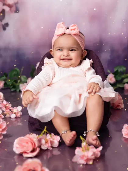 That happy, gummy smile is what milestone sessions are all about. Capturing their developing personality is our passion.