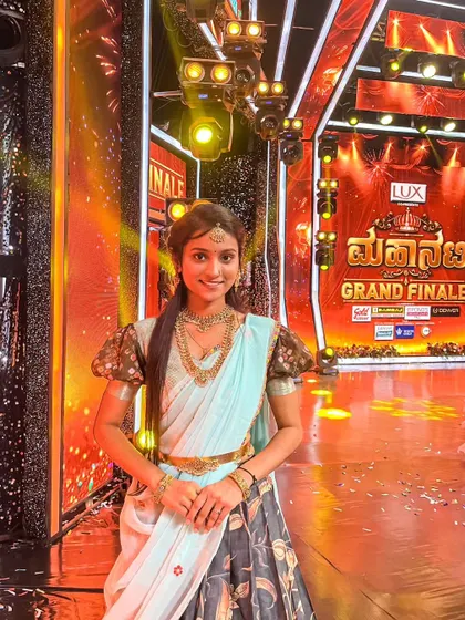 An artist on the grand finale of a show, wearing a simple yet elegant antique gold necklace set from my collection.