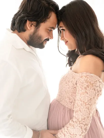 An intimate close-up that focuses on the couple's connection. The soft, high-key lighting creates a dreamy and romantic mood.