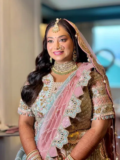 A smiling portrait of the bride, looking radiant and ready for her ceremony.