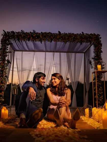 A romantic candlelit setup for a pre-wedding shoot at dusk. The warm glow of the candles creates an incredibly intimate and magical atmosphere for your photos.