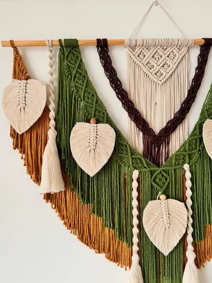 Another angle of the custom earthy wall hanging, showing how the different colored sections and leaf details are layered to create depth.