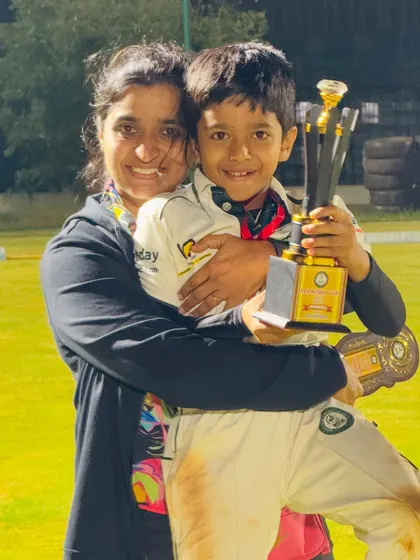 A heartwarming moment as a young player celebrates his victory with his mother.