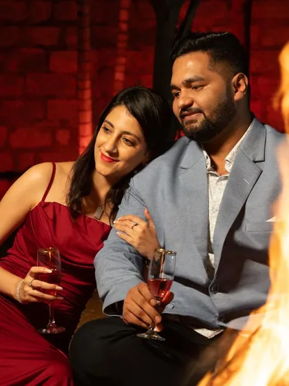 An evening pre-wedding shoot with a romantic, fireside setting. I created a slightly more glamorous look with a red lip for the bride to match the mood.