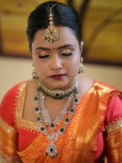 This shot highlights the stunning gold eyeshadow and perfectly blended foundation. My goal is to ensure the makeup looks impeccable from every angle.