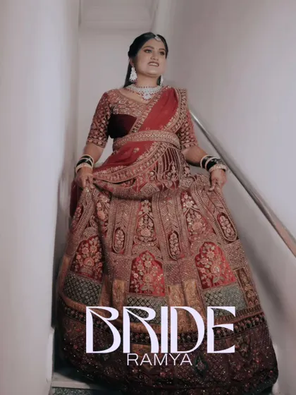 A stunning full-length shot of the bride in her intricate red and gold reception lehenga. I make sure to capture the beauty of the bridal outfit.