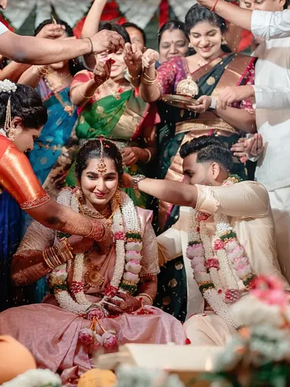 A candid moment of a couple being blessed by their family during the wedding ceremony. We capture the love and support surrounding you.