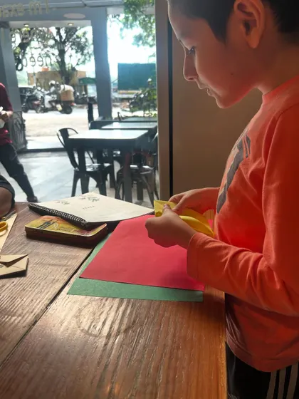 Here, a young student is deeply engaged in an origami project. This kind of focused, hands-on work is not just about creating something beautiful; it's about developing patience, perseverance, and a keen eye for detail.