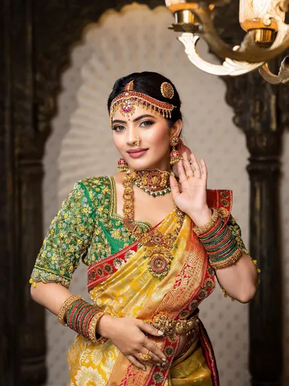 This detailed photoshoot showcases a complete South Indian bridal look, from the intricate matha patti and layered necklaces to the flawless airbrush makeup and traditional saree draping.
